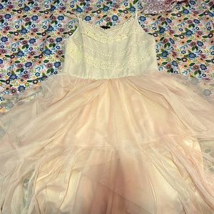 The dress has been warned twice it was made by zenzi it’s pink and white